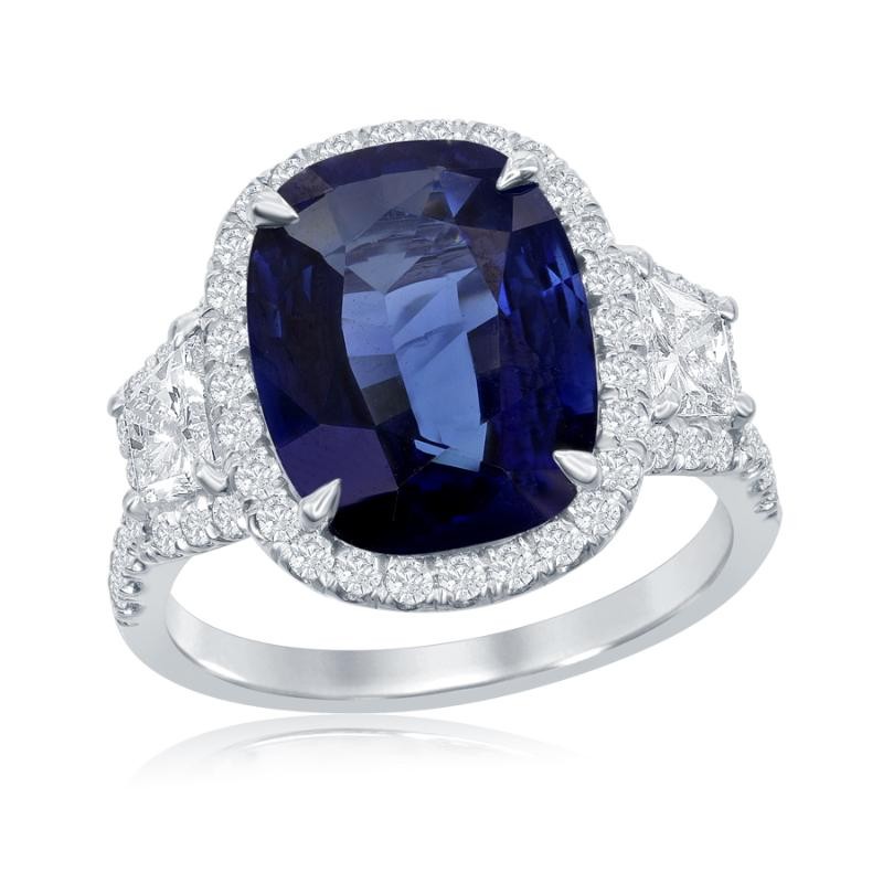 Platinum Three Stone Design With Trapezoid Cut Side Stones And Halo Cocktail Ring